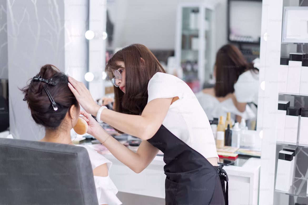 Beauty student practicing makeup at Nashik institute